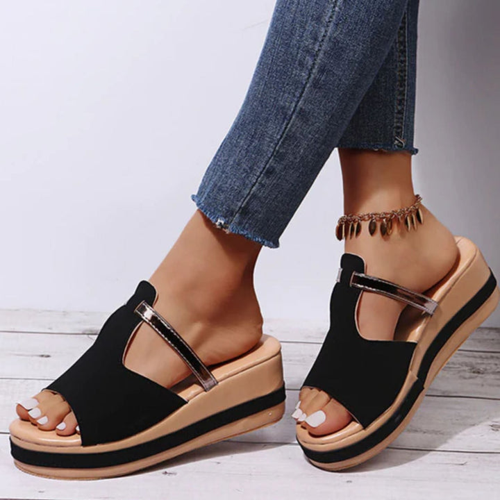 Women's orthopedic sandals with raised sole, arch support, and all-day comfort. Stylish casual summer footwear.