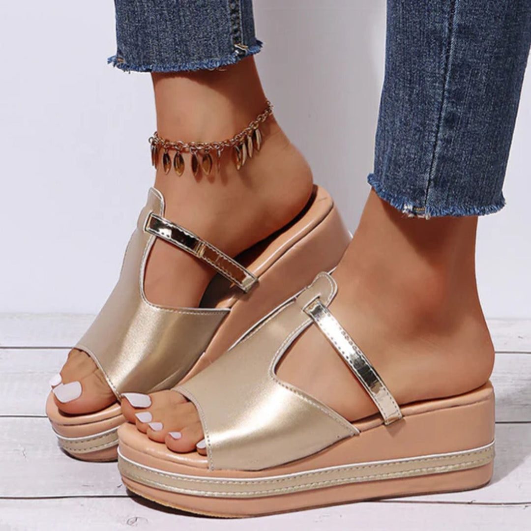 Comfortable women's orthopedic sandals with raised sole, providing arch support for all-day wear. Stylish casual summer shoes.