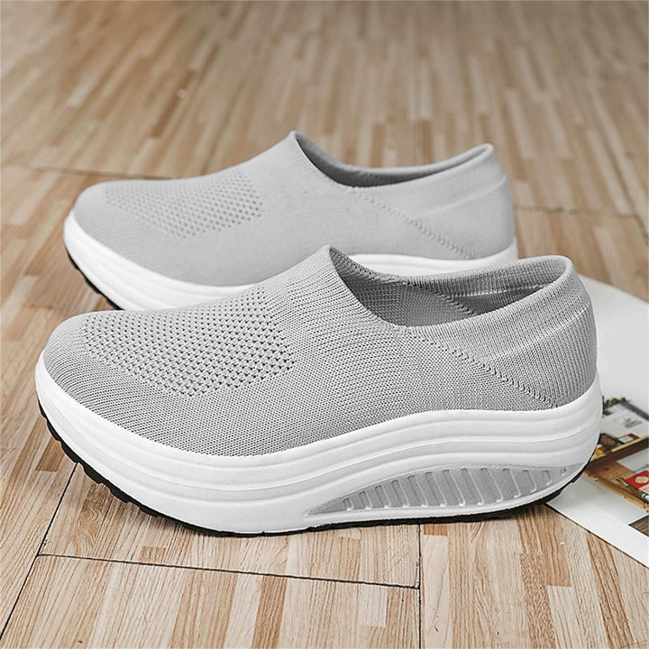 Women's slides featuring a cushioned orthopedic footbed and arch support for all-day comfort.