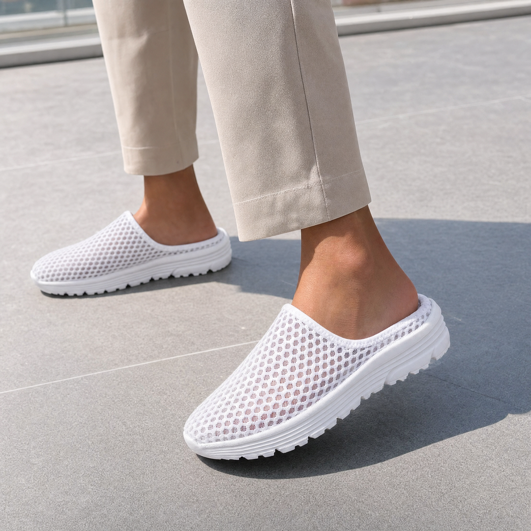Cushioned women's slip-on sneakers offering orthopedic arch support for ultimate walking comfort.