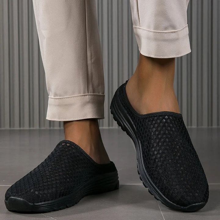Athletic women's slip-on sneakers, orthopedic comfort with arch support for active walking.