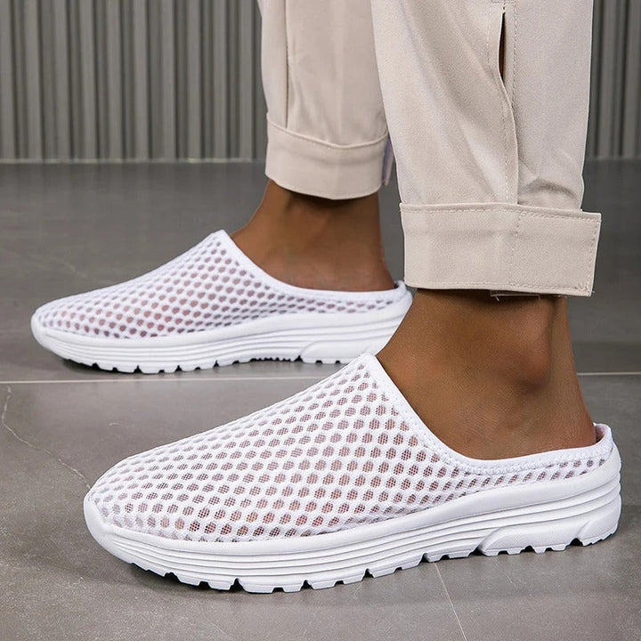 Slip-on women's orthopedic walking sneakers featuring arch support and cushioned comfort for easy wear.
