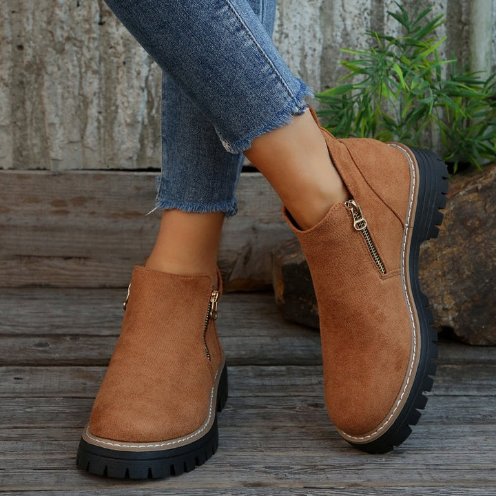 Black water-resistant orthopedic women's boots, perfect winter footwear for everyday comfort.