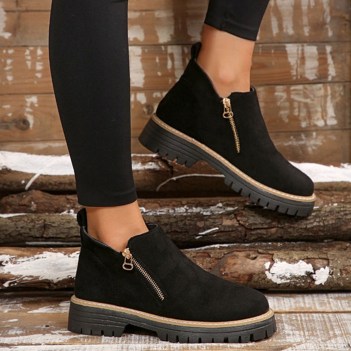 Water-resistant women's ankle boots, orthopedic support, perfect for wet weather & everyday comfort.