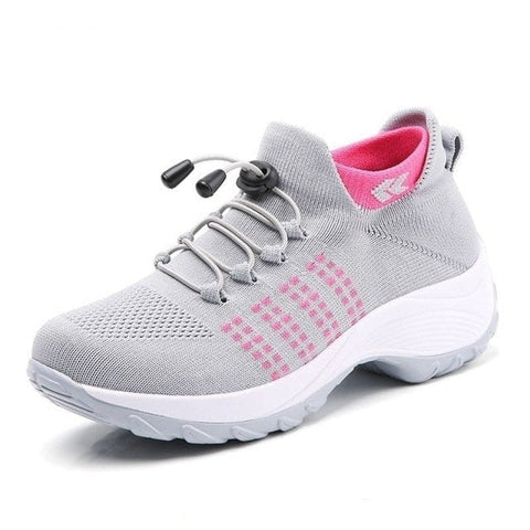 A model walking outdoors wearing Women's Orthopedic Support Walking Shoes, demonstrating active comfort.