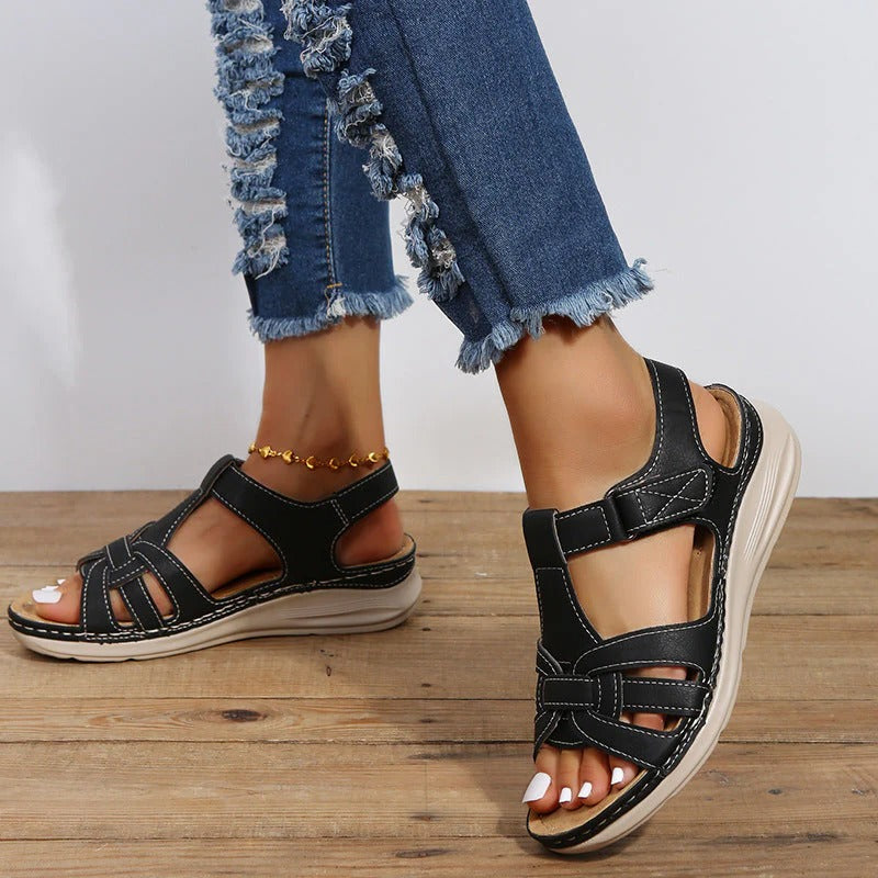 Elegant black women's orthopedic sandals with velcro closure, providing supportive comfort for summer casual wear.