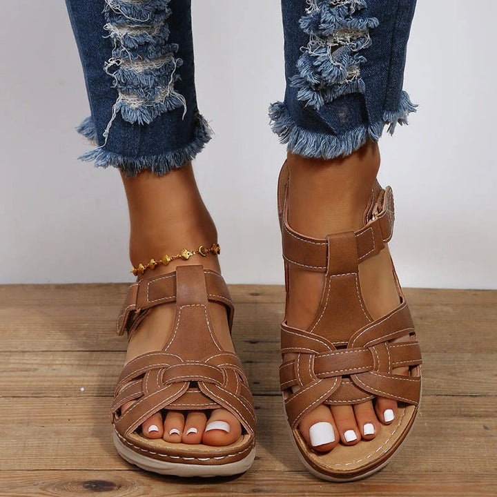 Comfortable women's velcro orthopedic flats for summer. Available in black & brown, featuring adjustable straps.