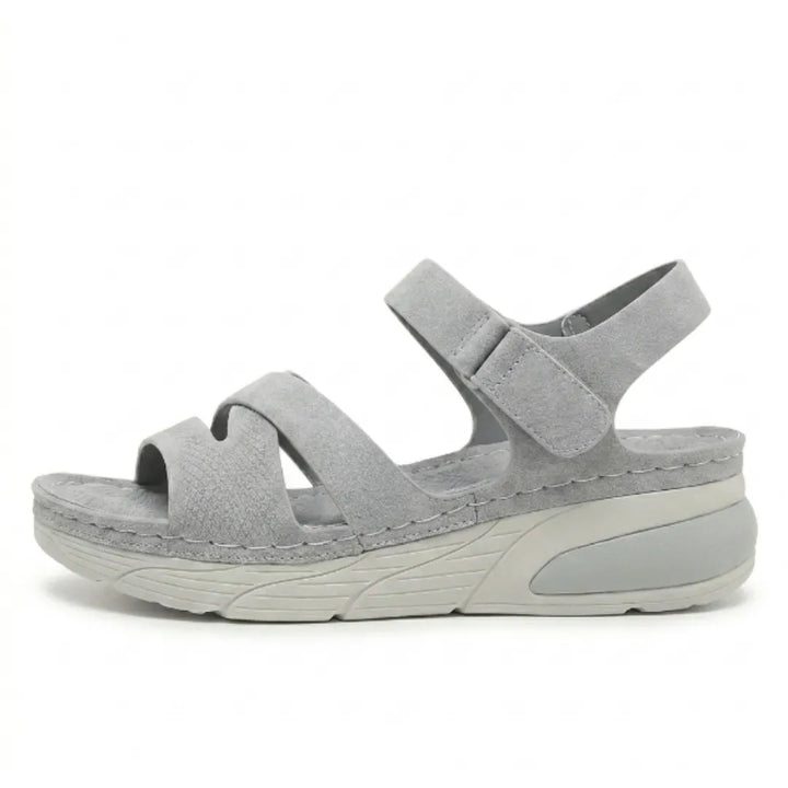 Ergonomic women's sandals, supportive arch, adjustable straps for comfortable daily walks.