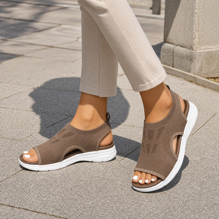 Comfortable women's walking sandals featuring arch support & adjustable straps.
