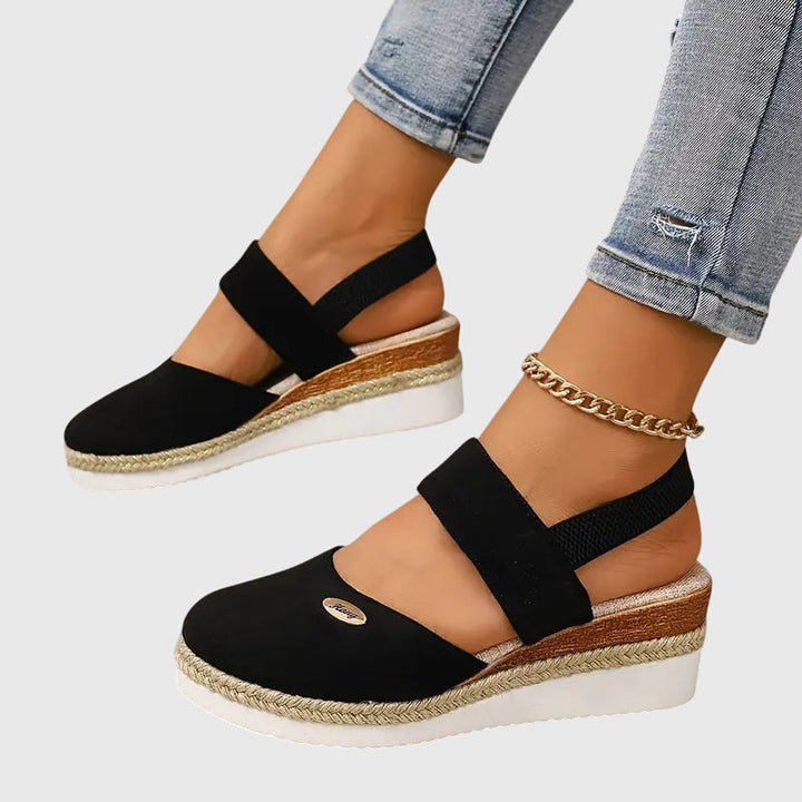 Side view of women's orthopedic walking sandals, showing cushioned sole and supportive arch.