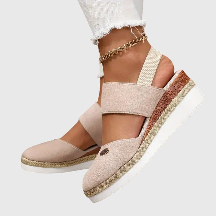 Women's orthopedic walking sandals on foot, showcasing comfortable fit and essential arch support.