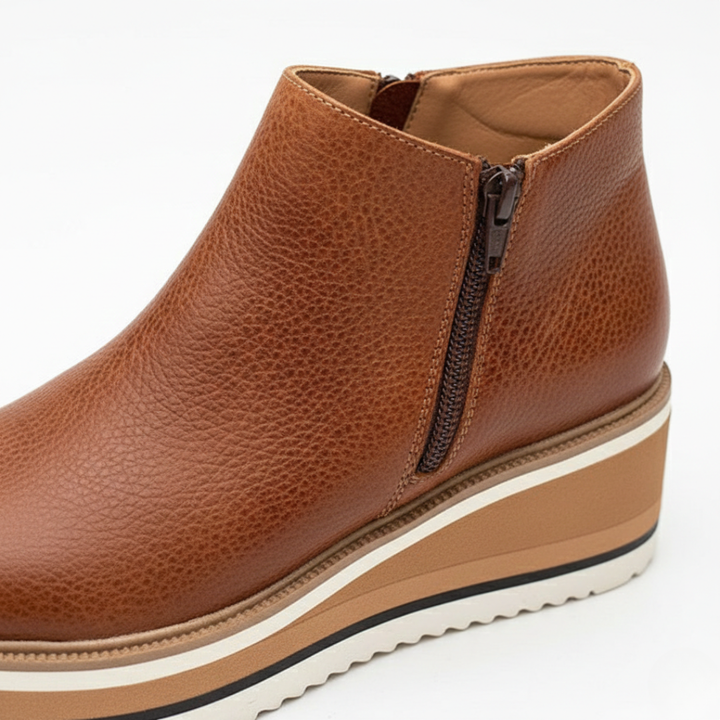 Stylish beige women's wedge ankle boots provide orthopedic comfort. Perfect everyday footwear for fall & winter.