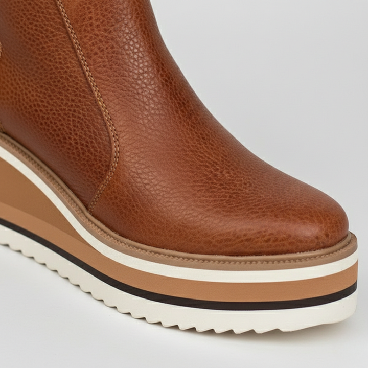 Black platform wedge ankle boots for women. Orthopedic design ensures comfort, ideal for winter everyday footwear.