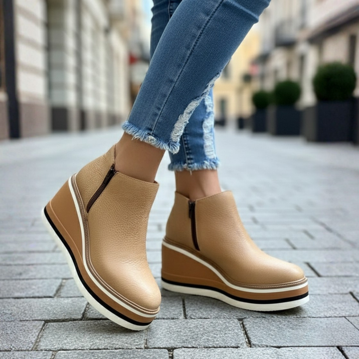 Fall/winter women's ankle boots. Stylish wedge heel & orthopedic comfort. Versatile everyday footwear.
