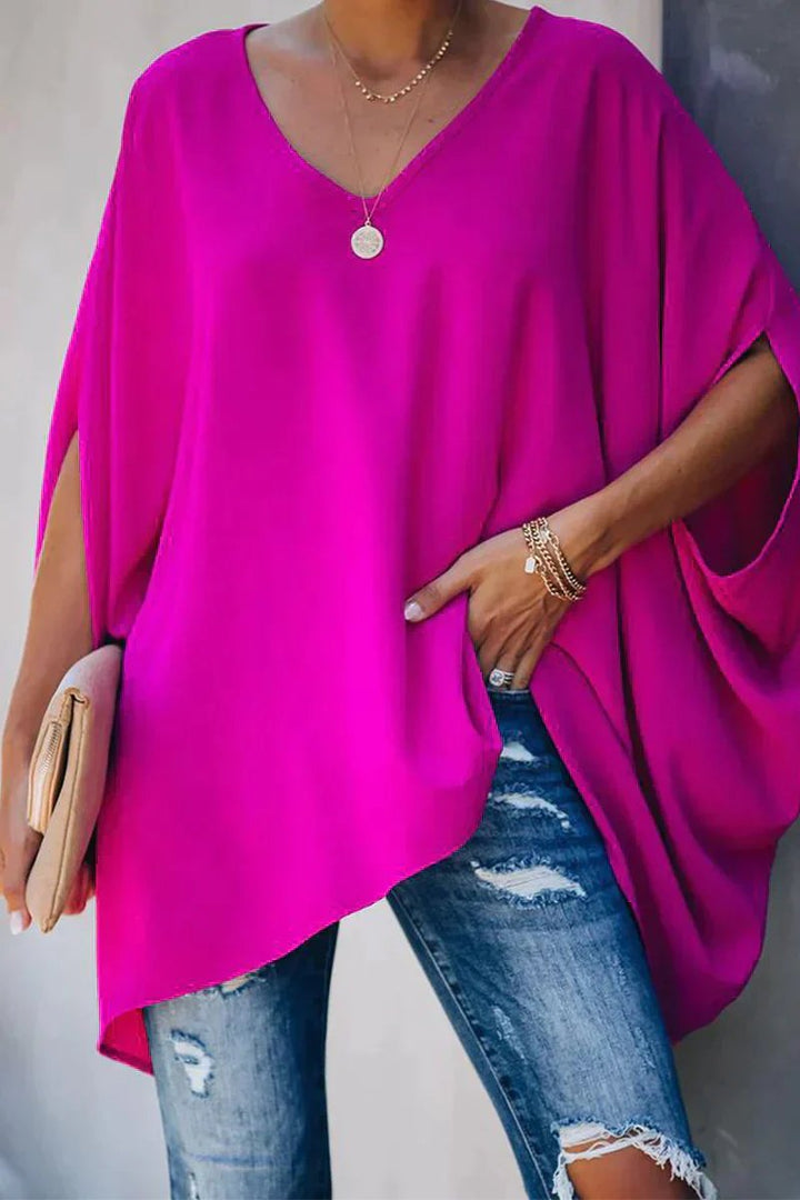 Women's oversized batwing sleeve v-neck tunic top. Relaxed fit for comfortable casual wear.
