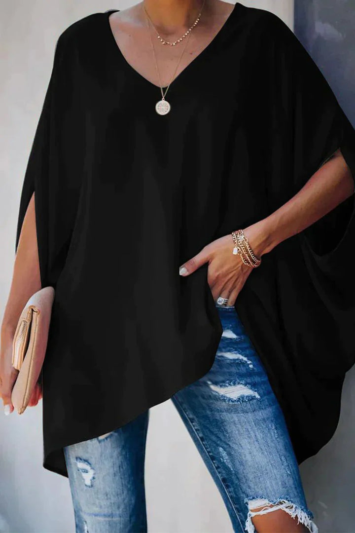 Black women's batwing sleeve v-neck tunic. Oversized, relaxed fit top for effortless, casual everyday style.