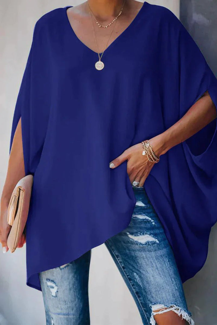 Blue women's comfortable oversized v-neck tunic top with elegant batwing sleeves. Perfect for relaxed casual wear.
