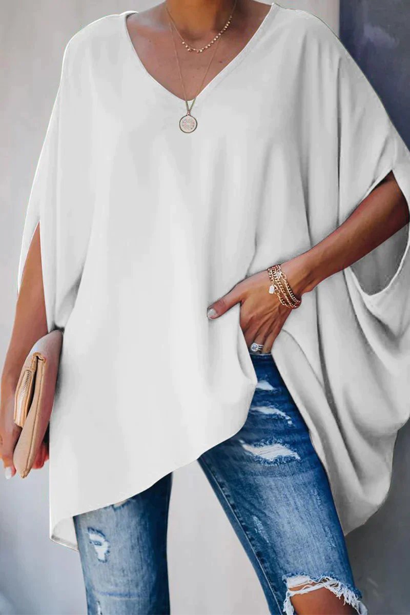 Fashionable women's white oversized tunic top. Features batwing sleeves & v-neck for a relaxed, comfortable fit.