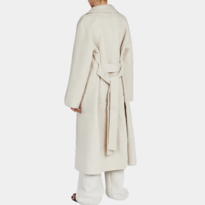 Chic women's long trench coat with belt, oversized style, perfect for sophisticated fall fashion.