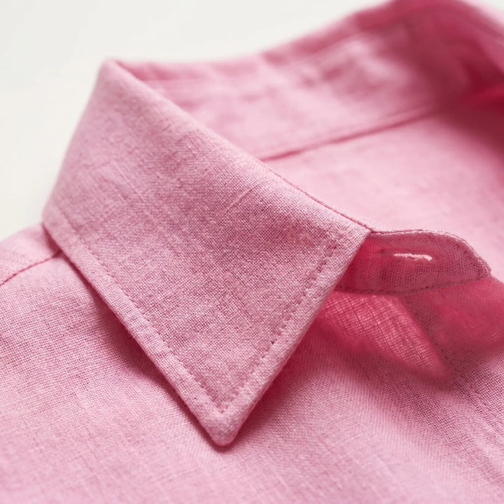 Relaxed fit women's long sleeve button-down shirt. Comfortable oversized top for everyday casual wear.