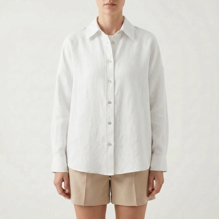 Oversized button-down shirt for women, offering a loose fit. A breathable long sleeve top for casual comfort.