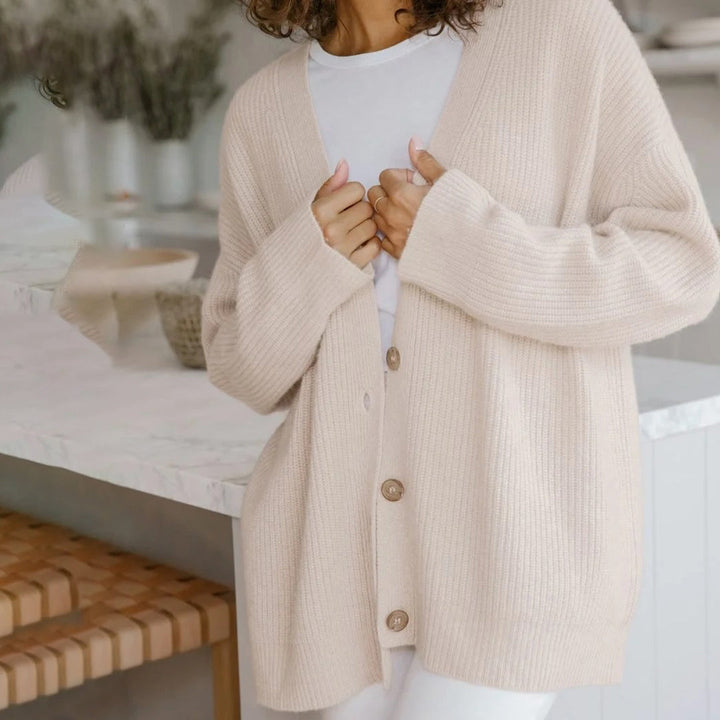 Versatile women's oversized cardigan, button-up long sleeve sweater for casual & layered outfits.