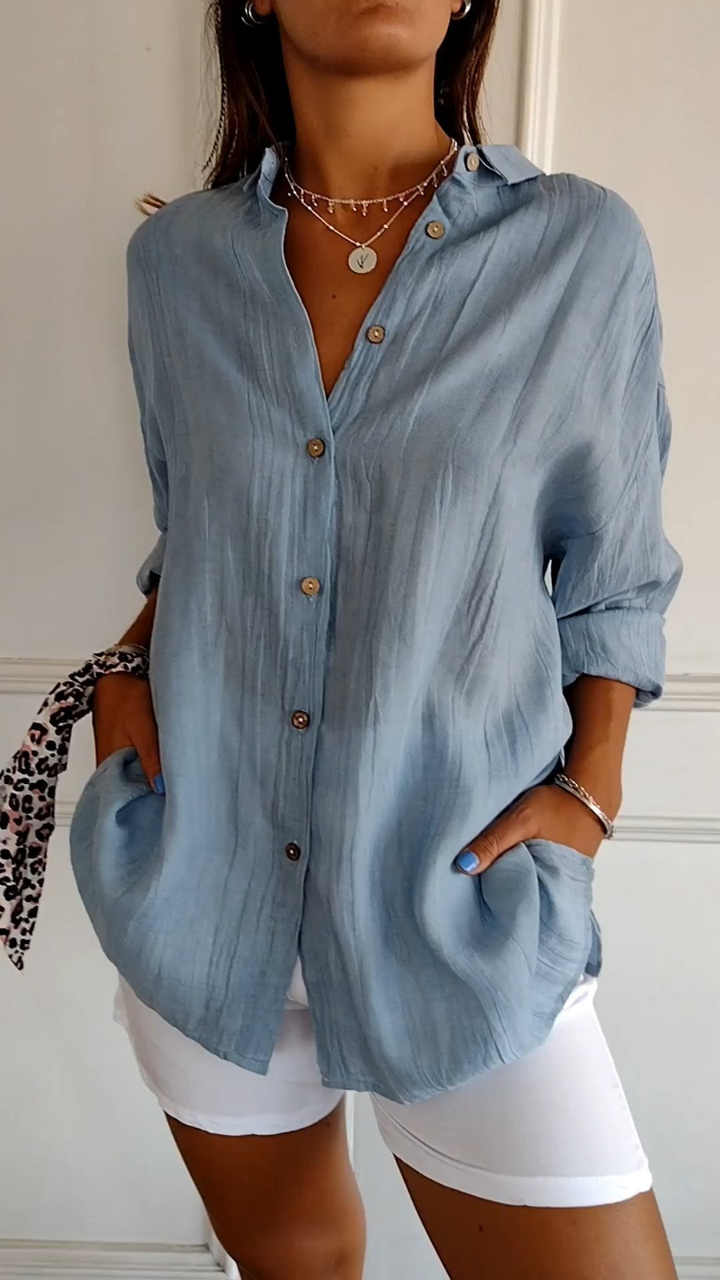 Women's oversized button-up shirt, long sleeve, relaxed fit. Perfect for casual everyday wear.