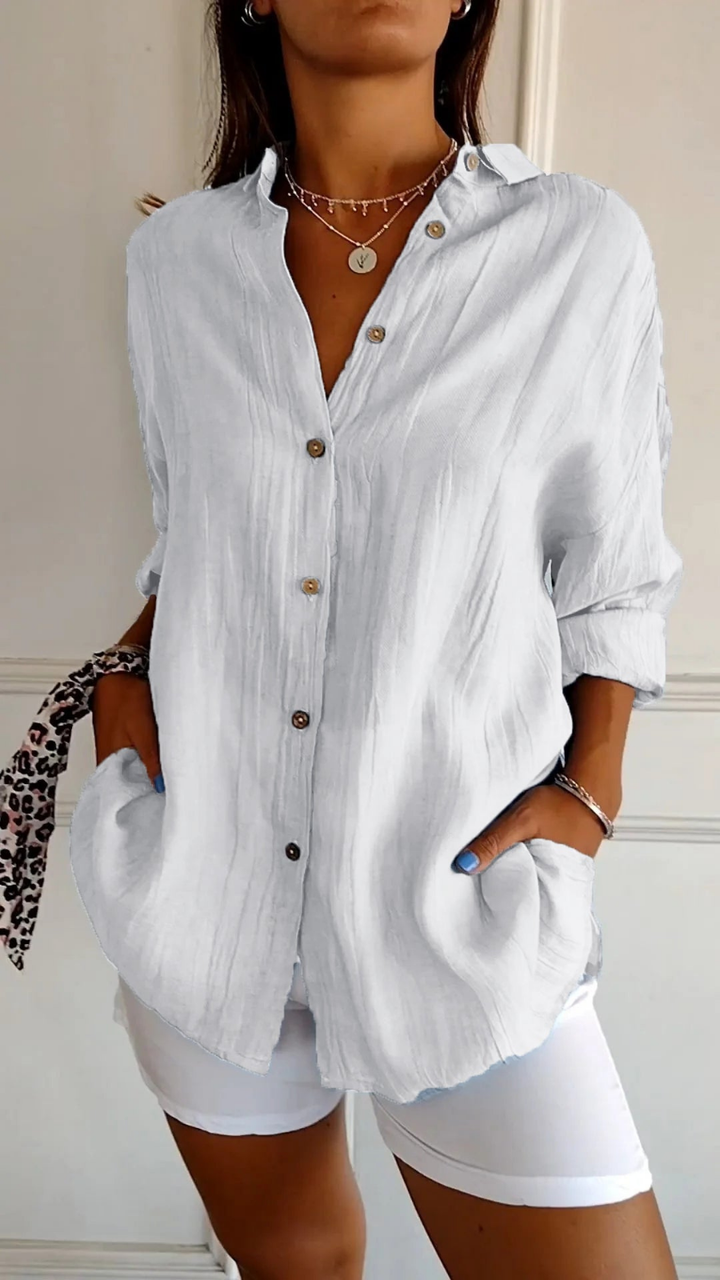 Classic women's oversized long sleeve button-up shirt. Timeless design, relaxed fit, perfect for everyday fashion.