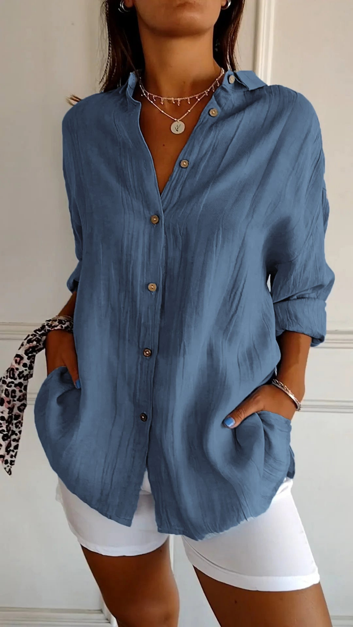Comfortable women's oversized button-up shirt with long sleeves. Relaxed fit, great for all-day wear.
