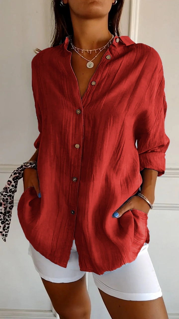 Light blue women's oversized button-up shirt, long sleeve, relaxed fit. Spring & summer casual blouse.