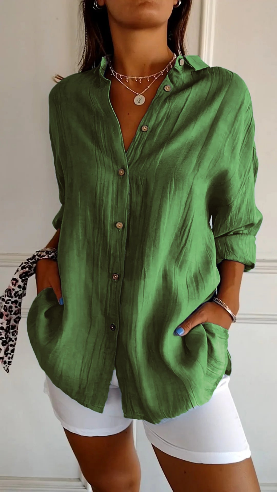 Women's button-up shirt, oversized long sleeve, with classic front buttons. Effortless relaxed fit.