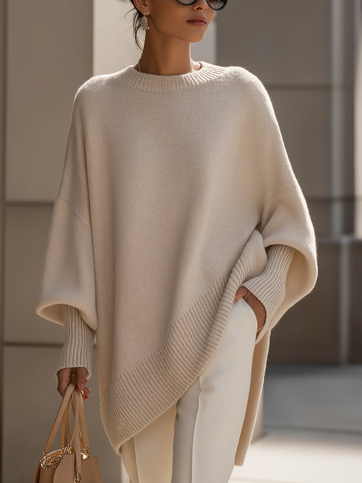 Women's oversized cape poncho top with elegant batwing sleeves, perfect for stylish layering and comfort.