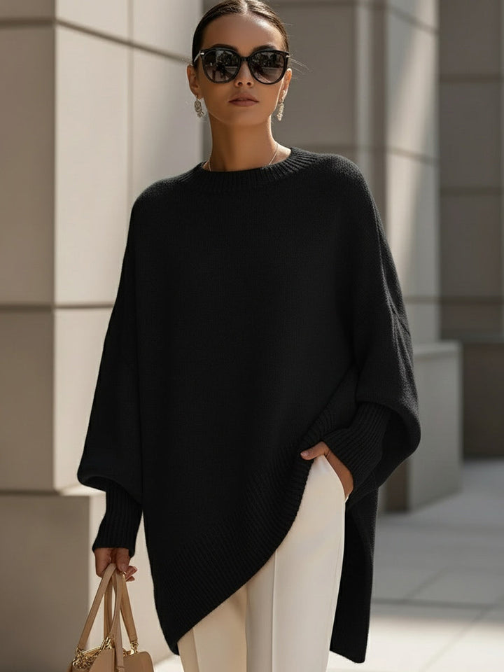 Stylish women's oversized cape poncho top with graceful batwing sleeves, excellent for elegant autumn layering.