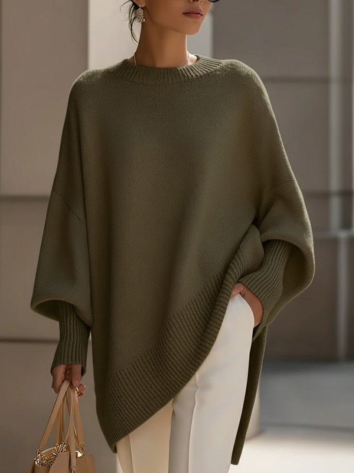 Versatile women's oversized cape poncho, an elegant batwing sleeve sweater perfect for comfortable autumn layering.