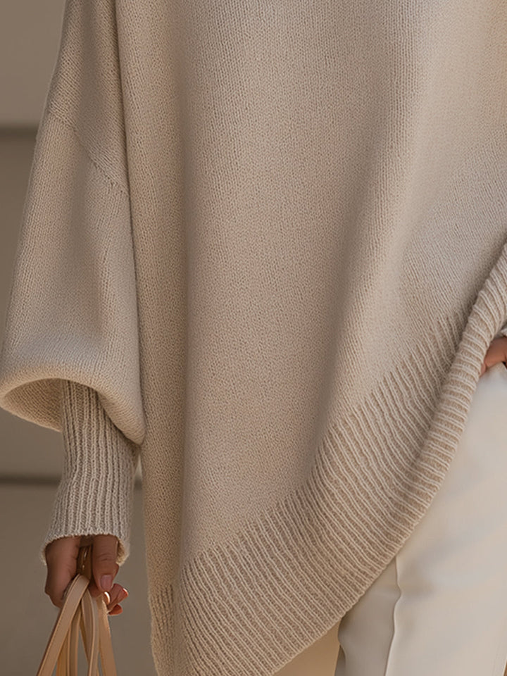 Comfortable women's batwing sleeve cape poncho, versatile for casual or elegant autumn layering.