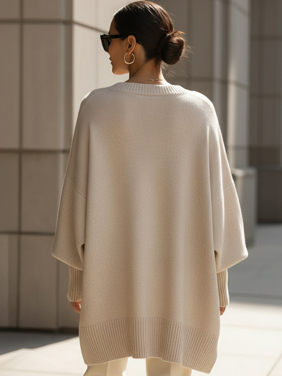 Elegant women's oversized cape poncho, a chic outerwear layer for versatile autumn fashion.