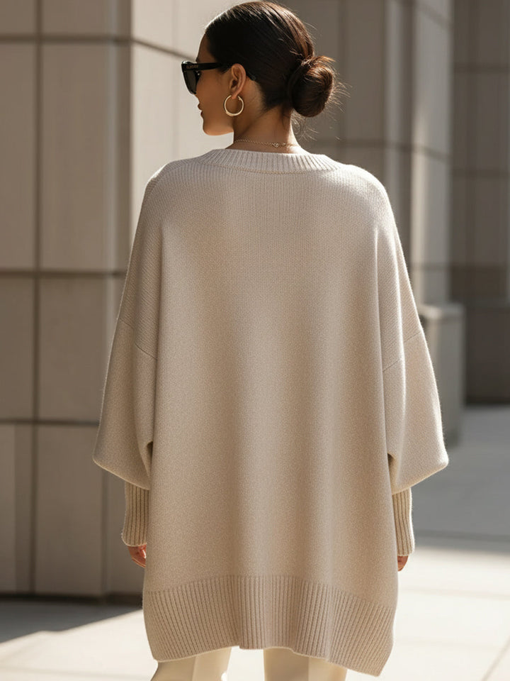 Elegant women's oversized cape poncho, a chic outerwear layer for versatile autumn fashion.