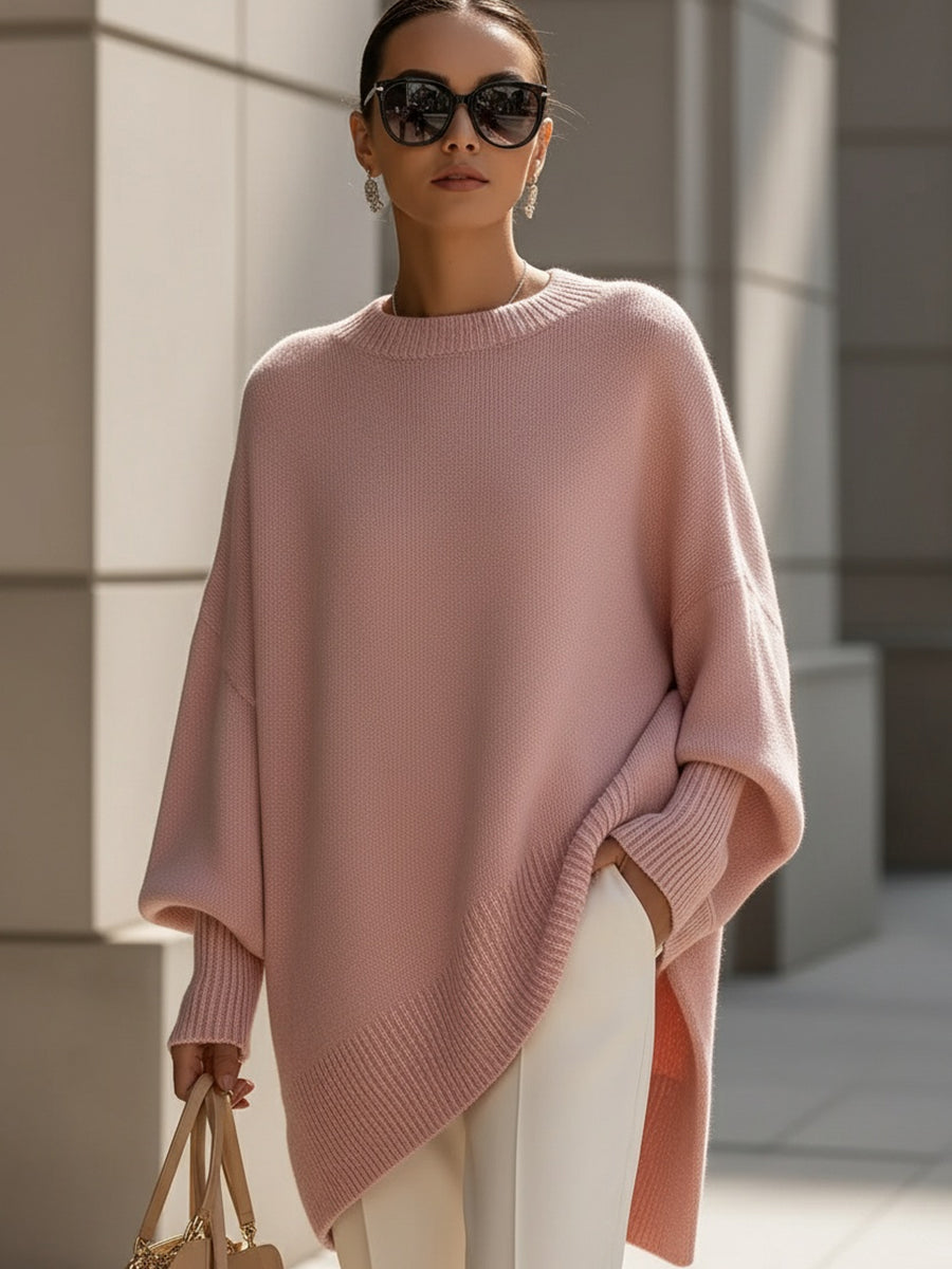 Oversized women's cape poncho sweater with elegant batwing sleeves, versatile for chic autumn outfits.