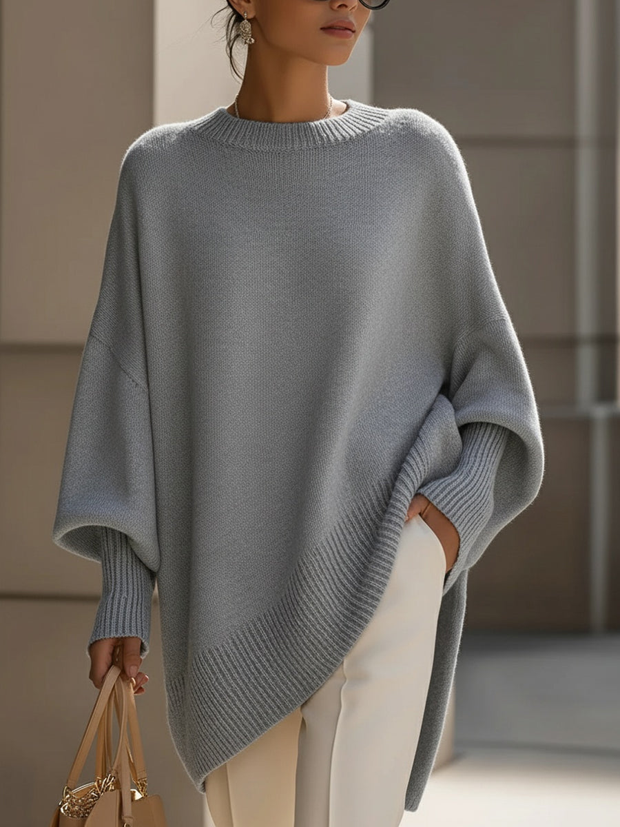 Women's elegant oversized cape poncho, a chic batwing sleeve layering piece for versatile autumn fashion.