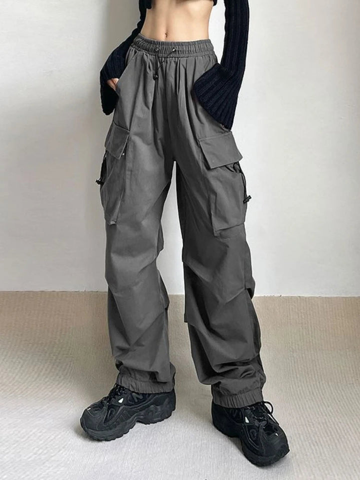 Close-up of women's relaxed fit cargo pants showing large utility pockets and durable fabric.