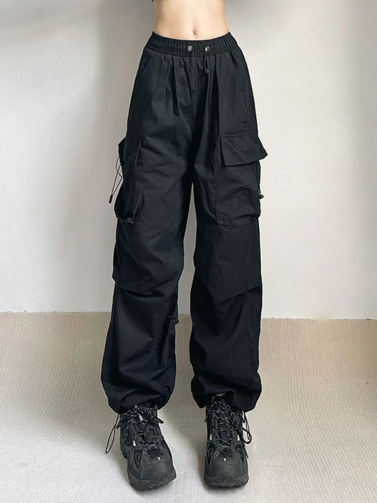 Back view of women's oversized cargo pants, highlighting the relaxed wide leg and comfortable fit.