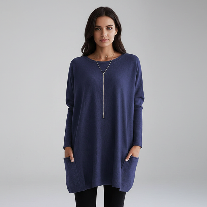 Woman wearing a relaxed oversized long sleeve sweater, embodying comfortable fall fashion.