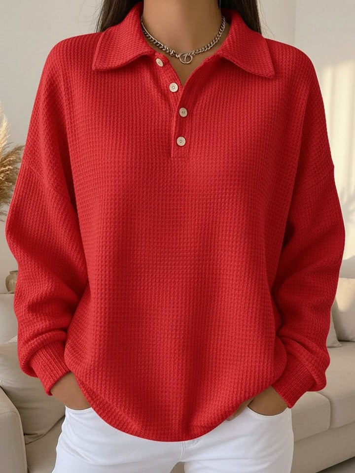 Stylish women's oversized Henley pullover with collar, comfortable drop shoulder design for casual everyday wear.