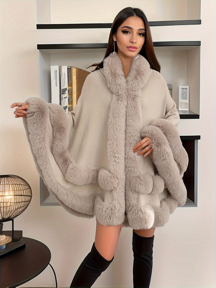 Warm & comfortable women's oversized cape coat with hood, ideal for autumn trends and plus size fashion.