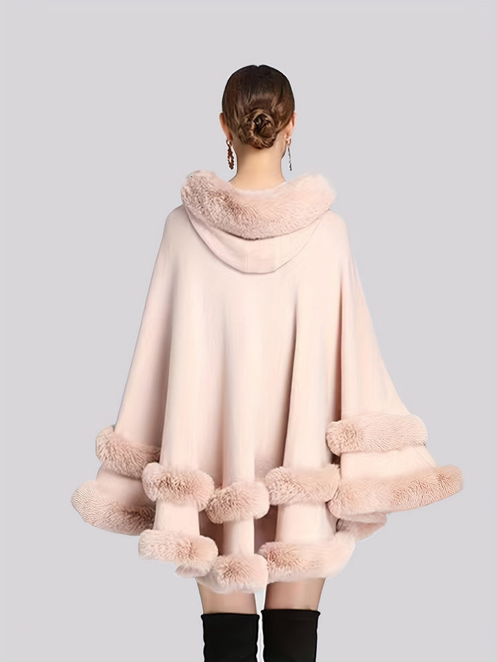 Versatile women's oversized cape coat, a trendy hooded jacket for comfortable and stylish autumn layers.