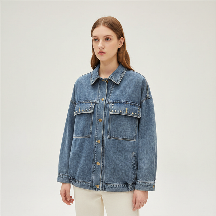 Boho style women's oversized denim jacket, Theresa, featuring unique floral patterns and trendy fringe.