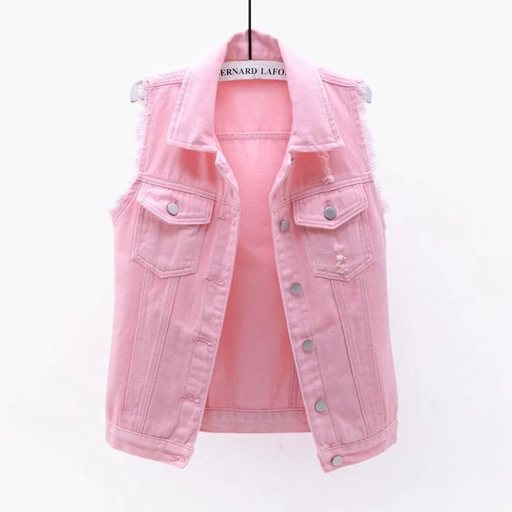 Women's oversized distressed denim vest, perfect for edgy street style layering.