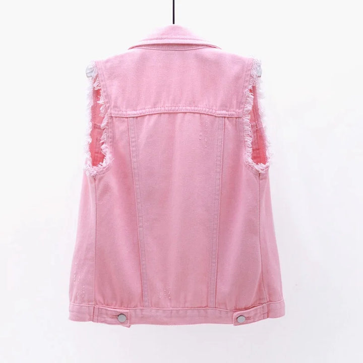 Edgy oversized denim vest for women, featuring a stylish distressed finish.