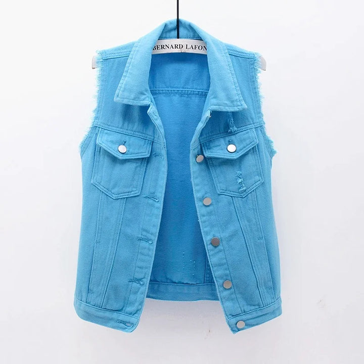 Street style women's oversized denim vest, showing off its unique distressed look.