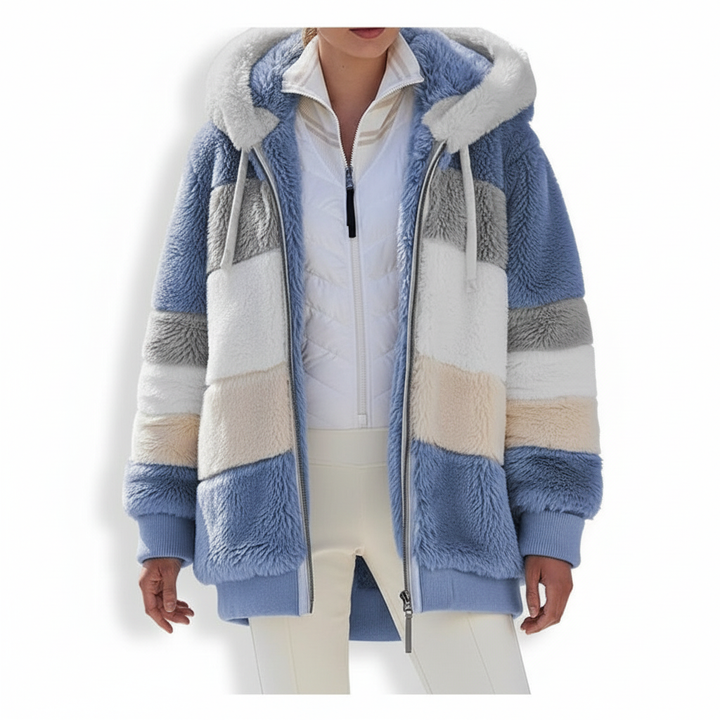 Oversized fleece hooded vest in a natural setting, highlighting its cozy and stylish design